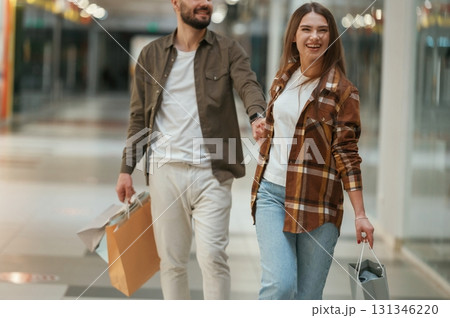 Guy don't want to go for shopping. Young couple are in supermarket together 131346220