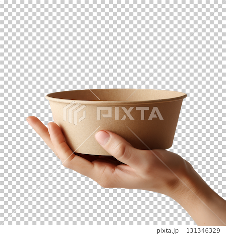 Hand holding a mockup empty large brown takeaway paper bowl, isolated on a transparent background. 131346329
