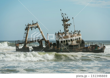 View of abandoned old drowned ship in the sea of Africa 131346669