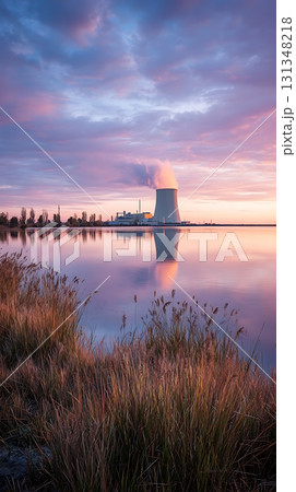 Cooling Tower at Sunset Reflected on Lake with Tall Grass in Foreground Cooling Tower at Sunset Reflected on Lake with Tall Grass in Foreground 131348218