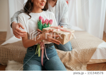 Conception of Valentine's day, embracing. Young couple are together at home Conception of Valentine's day, embracing. Young couple are together at home 131348578