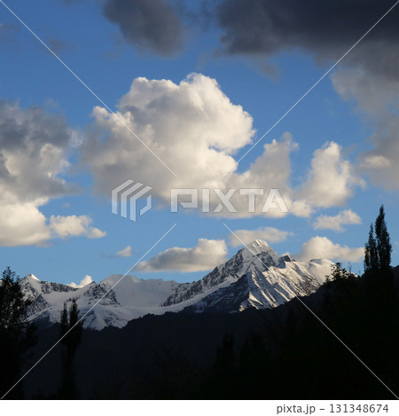 Sun lit  peak at sunset seen from Leh, India. 131348674