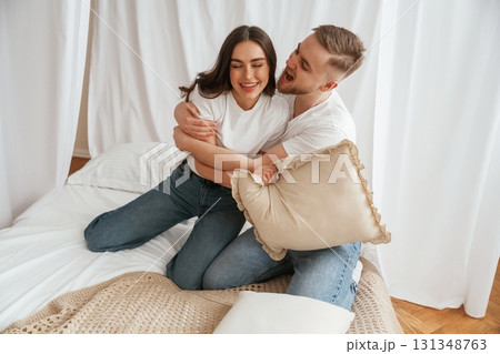 Embracing each other. Young couple are together at home 131348763