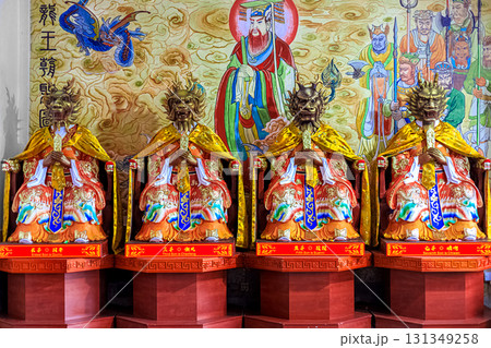Golden dragon-headed statues in colorful ceremonial robes. Nianshan Park, Sanya, China. March 1, 2024. Golden dragon-headed statues in colorful ceremonial robes. Nianshan Park, Sanya, China. March 1, 2024. 131349258