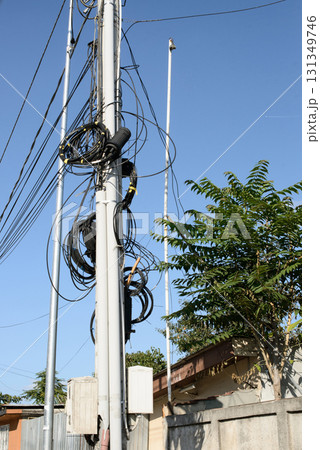Urban Utility Pole with Tangled Communication Wiring Urban Utility Pole with Tangled Communication Wiring 131349746