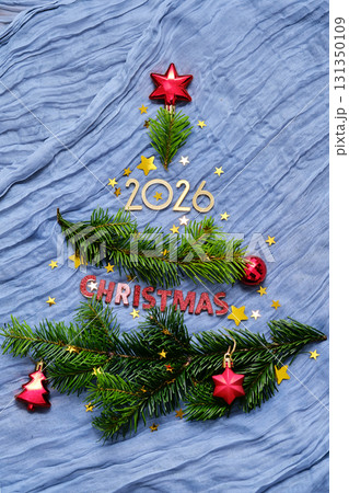 New Year background with branches in the shape of a Christmas tree. New Year background with branches in the shape of a Christmas tree. 131350109