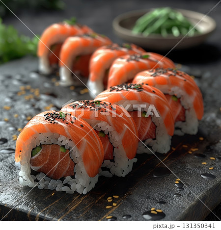A sushi roll with a black sesame seed garnish A sushi roll with a black sesame seed garnish 131350341