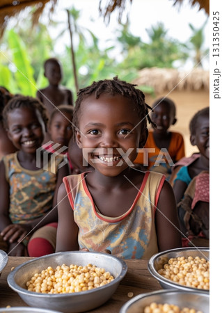 A group of children are smiling and eating food 131350425