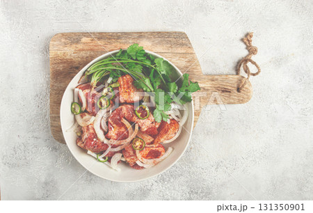 raw meat marinated with spices and onions, for barbecue, sliced meat, pork neck, in a bowl, homemade, no people, raw meat marinated with spices and onions, for barbecue, sliced meat, pork neck, in a bowl, homemade, no people, 131350901