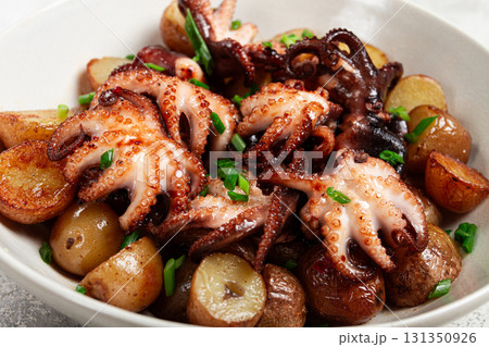 baby grilled octopus with golden baked potatoes and fresh herbs, Maltese cuisine, homemade, no people, baby grilled octopus with golden baked potatoes and fresh herbs, Maltese cuisine, homemade, no people, 131350926