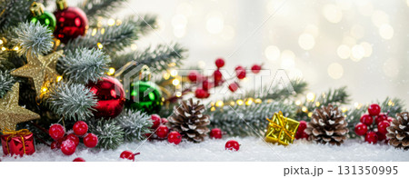 Christmas holiday banner with snow-covered ornaments and golden bokeh. Christmas holiday banner with snow-covered ornaments and golden bokeh. 131350995