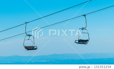 Chair Lift above the mountains and green forest of Bulgaria. Eco tourism. Tourist attraction. Seven Rila lakes. Cable car in Rila Mountains 131351254
