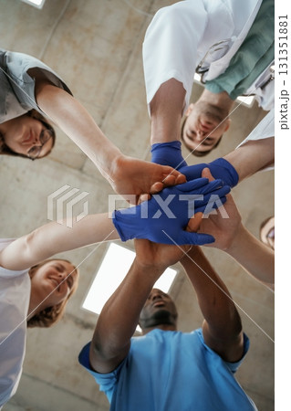 Celebrating success, hands gestures. View from below of group of doctors 131351881