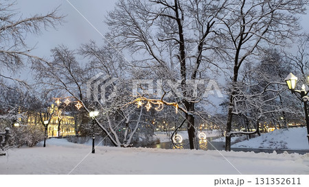 Snow-covered urban park in winter city landscape. 131352611