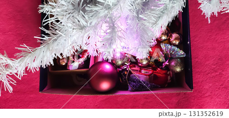 Festive ornaments for Christmas tree branches. 131352619