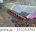 Freshly picked red grapes processing in a stainless steel industrial destemmer and crusher machine, separating stems from berries during the annual winemaking harvest season 131353762