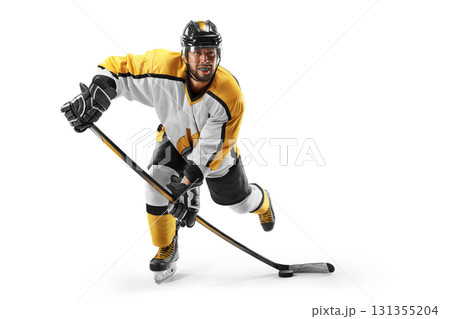 Hockey player on white background. Athlete in action. Professional hockey player in the helmet and gloves. Sports emotions. Hockey concept. Isolated Hockey player on white background. Athlete in action. Professional hockey player in the helmet and gloves. Sports emotions. Hockey concept. Isolated 131355204