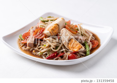 Thai food (Som Tum), Spicy papaya salad with steamed pork sausage and salted egg Thai food (Som Tum), Spicy papaya salad with steamed pork sausage and salted egg 131359458