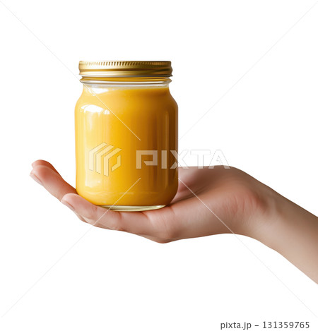 Hand holding a jar of orange smoothie, isolated on a transparent background. 131359765