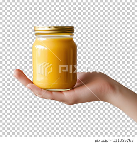 Hand holding a jar of orange smoothie, isolated on a transparent background. 131359765