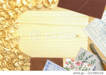 Woodworking tools and blueprints on wooden table with wood shavings 131360128