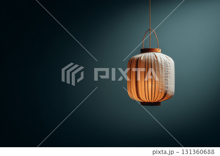 Glowing paper lantern against dark background 131360688
