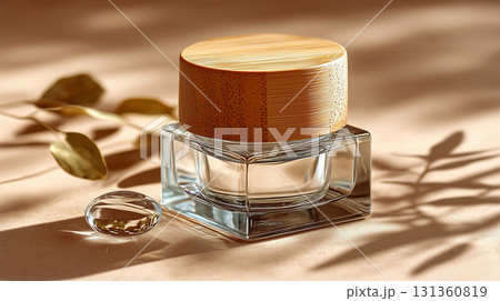 Transparent glass jar with bamboo lid on beige surface 131360819