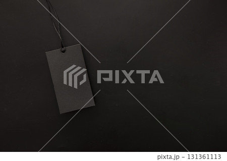 A blank black price tag on a dark background, ideal for showcasing discounts during a Black Friday sale. 131361113