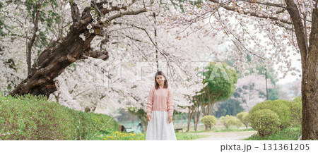 Woman tourist sightseeing Kajo Park Yamagata Castle Ruins with Sakura Cherry Blossom in Spring, happy traveler travel in Yamagata prefecture, Tohoku, Japan. famous Landmark for Travel and Vacation 131361205