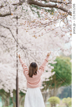 Woman tourist sightseeing Kajo Park Yamagata Castle Ruins with Sakura Cherry Blossom in Spring, happy traveler travel in Yamagata prefecture, Tohoku, Japan. famous Landmark for Travel and Vacation 131361206