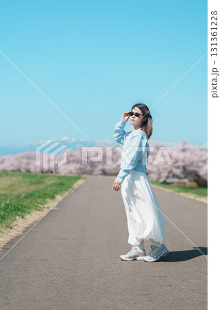 Woman tourist sightseeing Kitakami Tenshochi Park with Sakura Cherry Blossom in Spring, traveler travel in Kitakami festival, Iwate prefecture, Japan. Landmark for Travel and Vacation destination Woman tourist sightseeing Kitakami Tenshochi Park with Sakura Cherry Blossom in Spring, traveler travel in Kitakami festival, Iwate prefecture, Japan. Landmark for Travel and Vacation destination 131361228