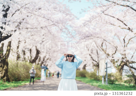 Woman tourist sightseeing Kitakami Tenshochi Park with Sakura Cherry Blossom in Spring, traveler travel in Kitakami festival, Iwate prefecture, Japan. Landmark for Travel and Vacation destination Woman tourist sightseeing Kitakami Tenshochi Park with Sakura Cherry Blossom in Spring, traveler travel in Kitakami festival, Iwate prefecture, Japan. Landmark for Travel and Vacation destination 131361232