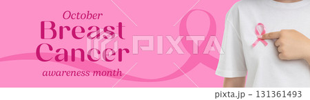 Individual highlights a pink ribbon for breast cancer awareness Individual highlights a pink ribbon for breast cancer awareness 131361493