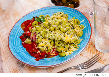 Spinach tortellini with vegetable sauce and grated cheese Spinach tortellini with vegetable sauce and grated cheese 131361927