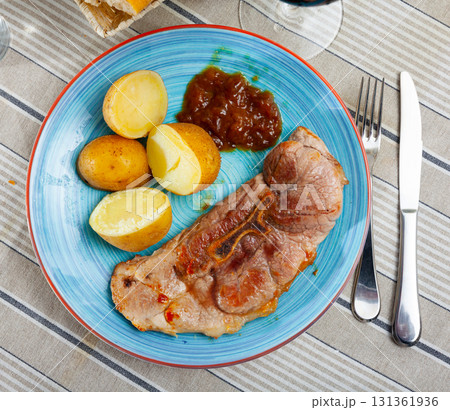 Appetizing fried pork with potatoes and herbs Appetizing fried pork with potatoes and herbs 131361936