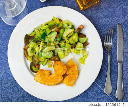 Fresh salad with chicken breast and lettuce on plate 131361945