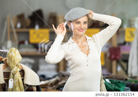 During November sales, european woman try on hat 131362154