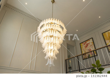 Interior view of elaborate crystal chandelier in a hotel lobby or luxury home Interior view of elaborate crystal chandelier in a hotel lobby or luxury home 131362444