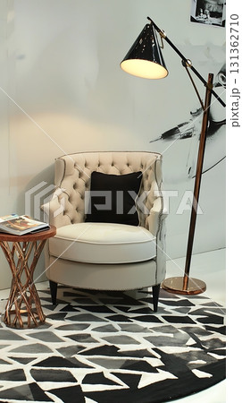 Chair is sitting in front of a lamp and a table 131362710
