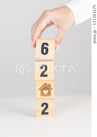 2026 with Home and Heart block. Property investment, House Mortgage, Real Estate tax, homeless, donation, Financial and happy family concepts 131363275