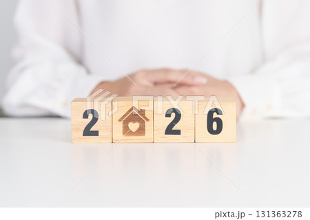 2026 with Home and Heart block. Property investment, House Mortgage, Real Estate tax, homeless, donation, Financial and happy family concepts 131363278