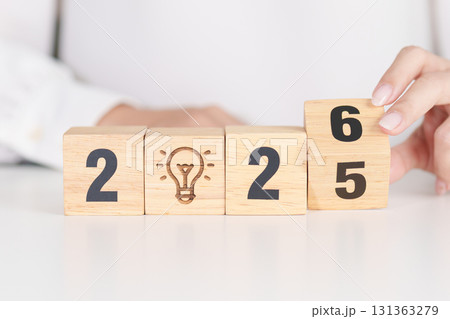 2025 year change to 2026 year block with lightbulb. Business Idea, Creative, Thinking, brainstorm, Goal, Resolution, strategy, plan, Action, change and New Year start concepts 2025 year change to 2026 year block with lightbulb. Business Idea, Creative, Thinking, brainstorm, Goal, Resolution, strategy, plan, Action, change and New Year start concepts 131363279