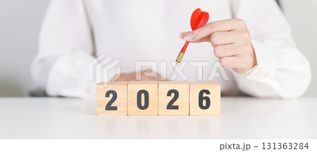 red dart with  chess people and 2026 year blocks.. Goal, plan, action, target, strategy, leadership, New Year and marketing concept 131363284