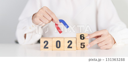 hand holding magnet over 2026 Year block. Human resource management, Recruitment, Teamwork, strategy, toxic people and leadership Concepts hand holding magnet over 2026 Year block. Human resource management, Recruitment, Teamwork, strategy, toxic people and leadership Concepts 131363288