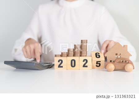 2025 end year to Happy New Year 2026 with car and Home model with coin stack. Car loan, Interest rate, real estate, house, Insurance, Financial, Repair, Tax, mortgage and Maintenance 131363321