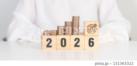 Happy New Year 2026 with Coins stack and dartboard icon. Strategy, goal, Money, Budget, tax, investment, financial, savings and New Year Resolution concepts Happy New Year 2026 with Coins stack and dartboard icon. Strategy, goal, Money, Budget, tax, investment, financial, savings and New Year Resolution concepts 131363322