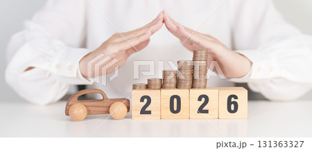 Happy New Year 2026 with hand cover money stack. car Insurance, Financial, vehicle Repair and Maintenance, Automobile Tax. Money Saving and New Year concept Happy New Year 2026 with hand cover money stack. car Insurance, Financial, vehicle Repair and Maintenance, Automobile Tax. Money Saving and New Year concept 131363327
