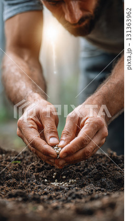 Planting seeds in soil with care and focus 131363962