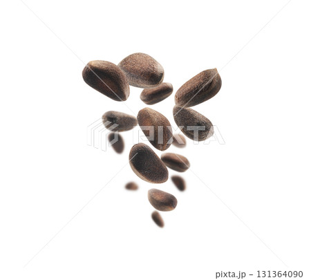 Pine nuts levitate on a white background 131364090
