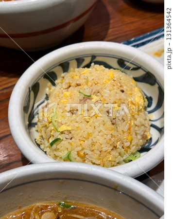 nasi goreng or fried rice traditional frying rice dish from indonesia made of Precooked rice fried in a small amount of oil, then spiced up with shallots, garlic, chili and sweet soy sauce. nasi goreng or fried rice traditional frying rice dish from indonesia made of Precooked rice fried in a small amount of oil, then spiced up with shallots, garlic, chili and sweet soy sauce. 131364542